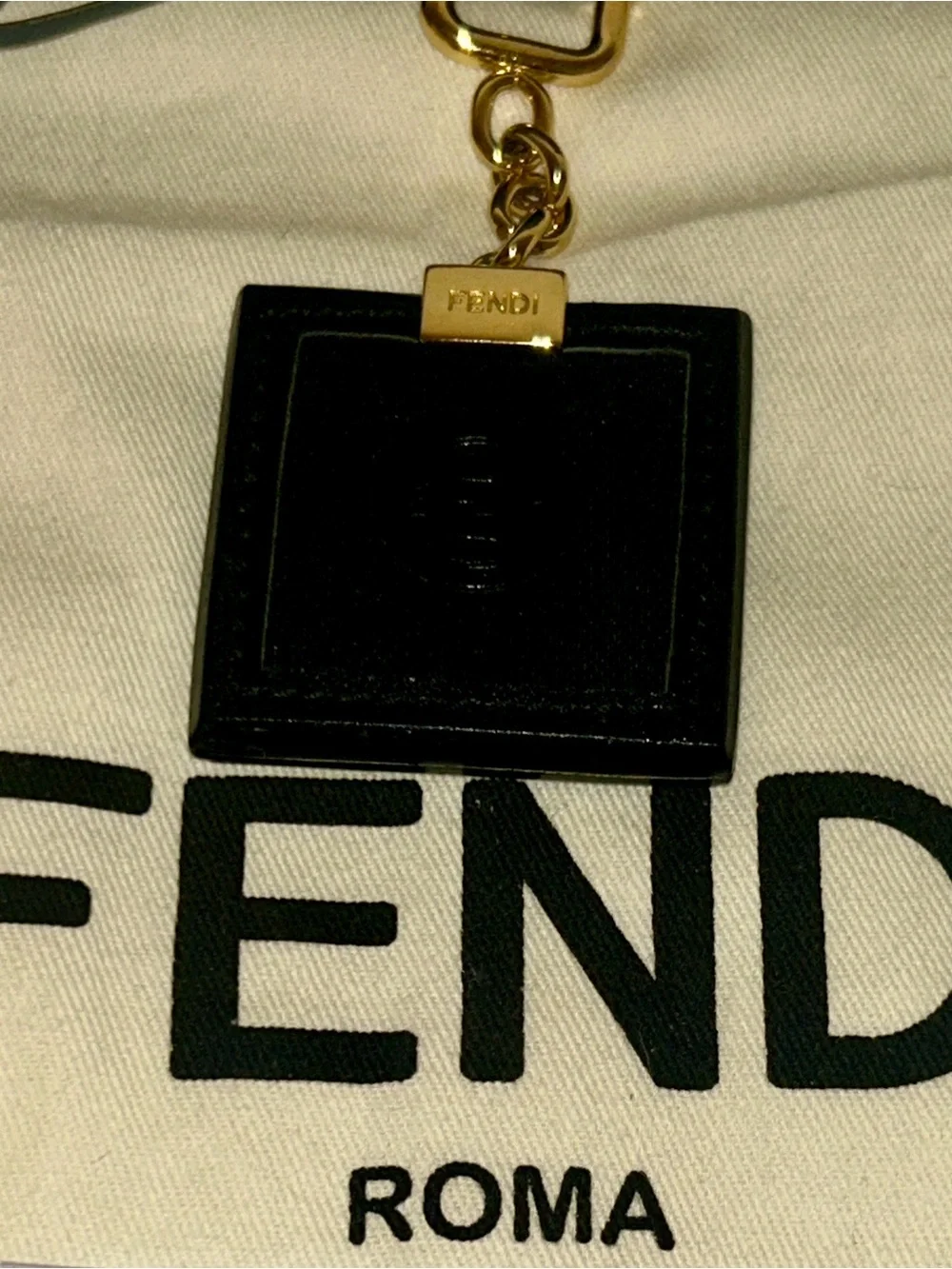 Fendi square leather keychain or Bag Charm.  Full Inclusion.  Vintage and Rare